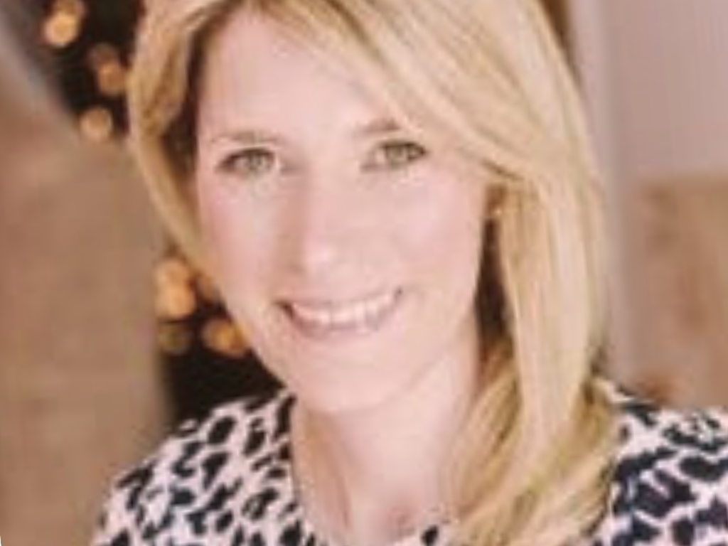 Image of Gemma Huggett, the partner product lead. Gemma looks very professional and friendly.